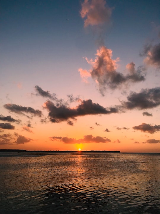 body of water under cloudy sky during sunset in Pulau Selayar Indonesia