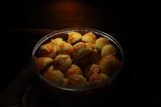Tray of pastel de queijo with steam rising, showing freshness.