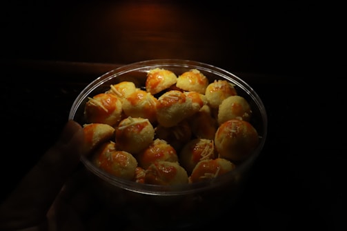 Tray of pastel de queijo with steam rising, showing freshness.