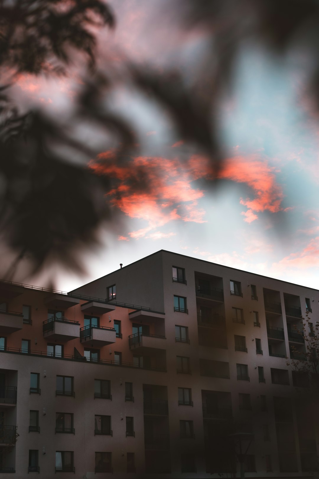 brown concrete building under cloudy sky