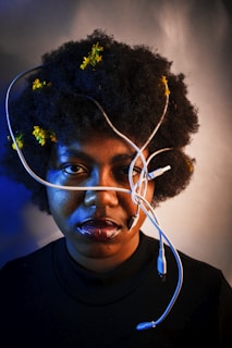 man in black crew neck shirt with white earbuds