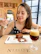 Warm image of a smiling woman enjoying a slice of chocolate cake with a cup of coffee.