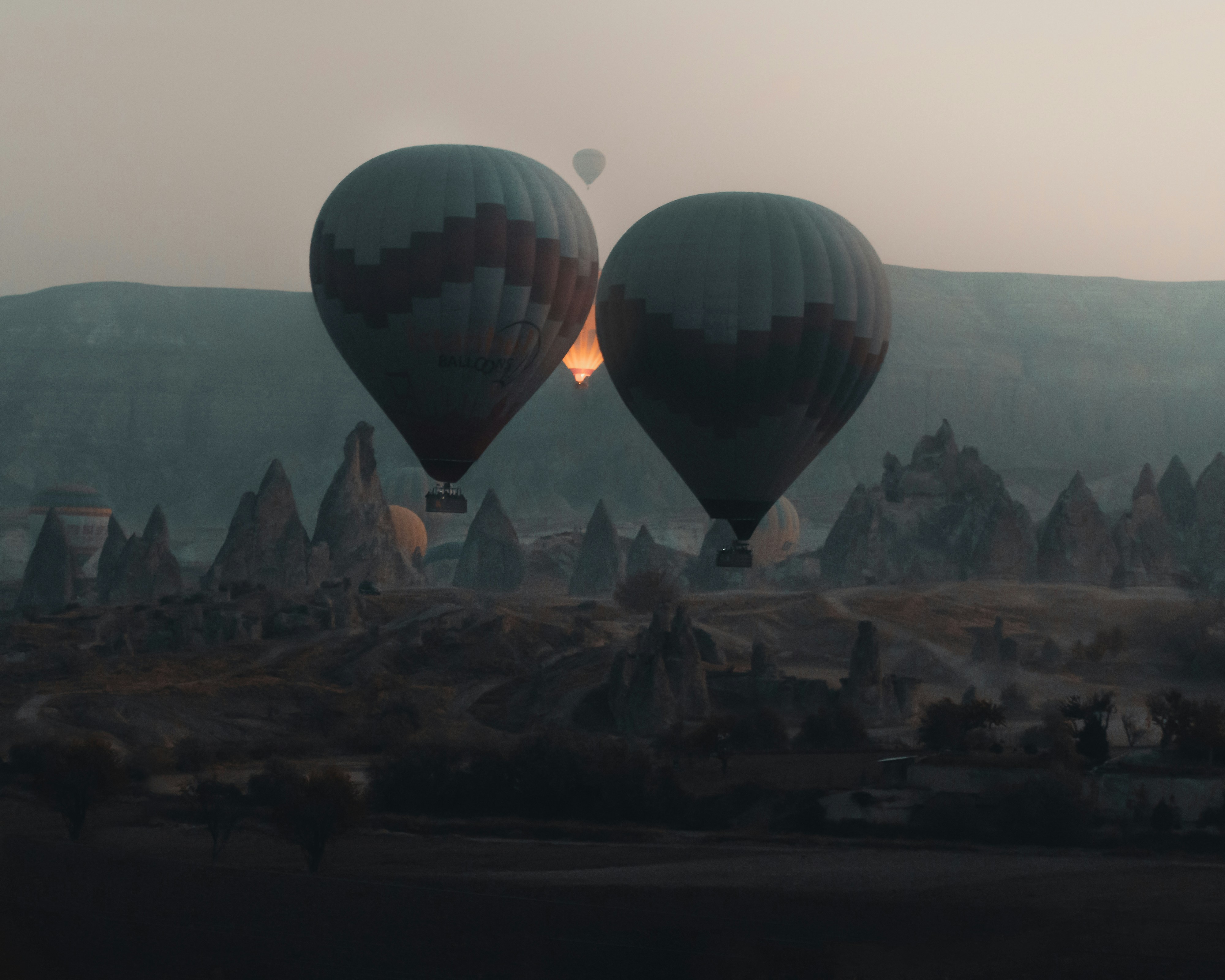 hot air balloons on the city during daytime
