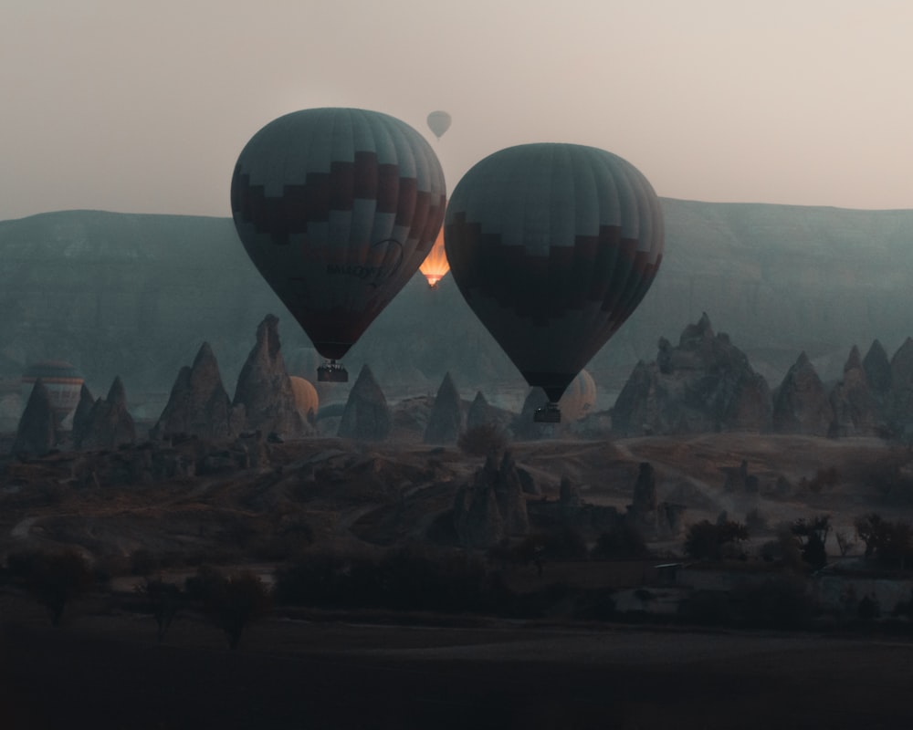 hot air balloons on the city during daytime