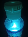 Bright bottles of energy supplements glowing under natural light.