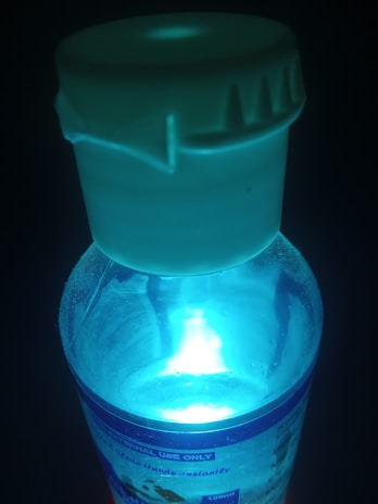 A close-up of a glowing product in a dark environment.