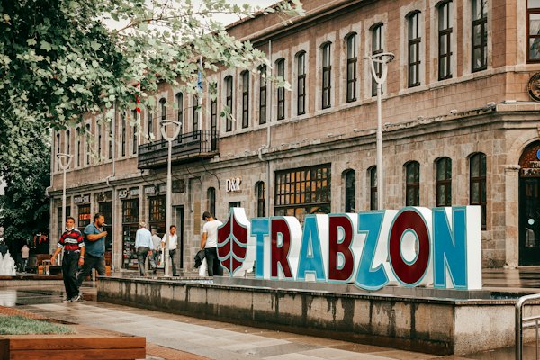 People walking on sidewalk near building during daytime — Trabzon, Turkey