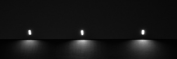 Layered lighting setup in a modern interior showing ambient, task, and accent lights.