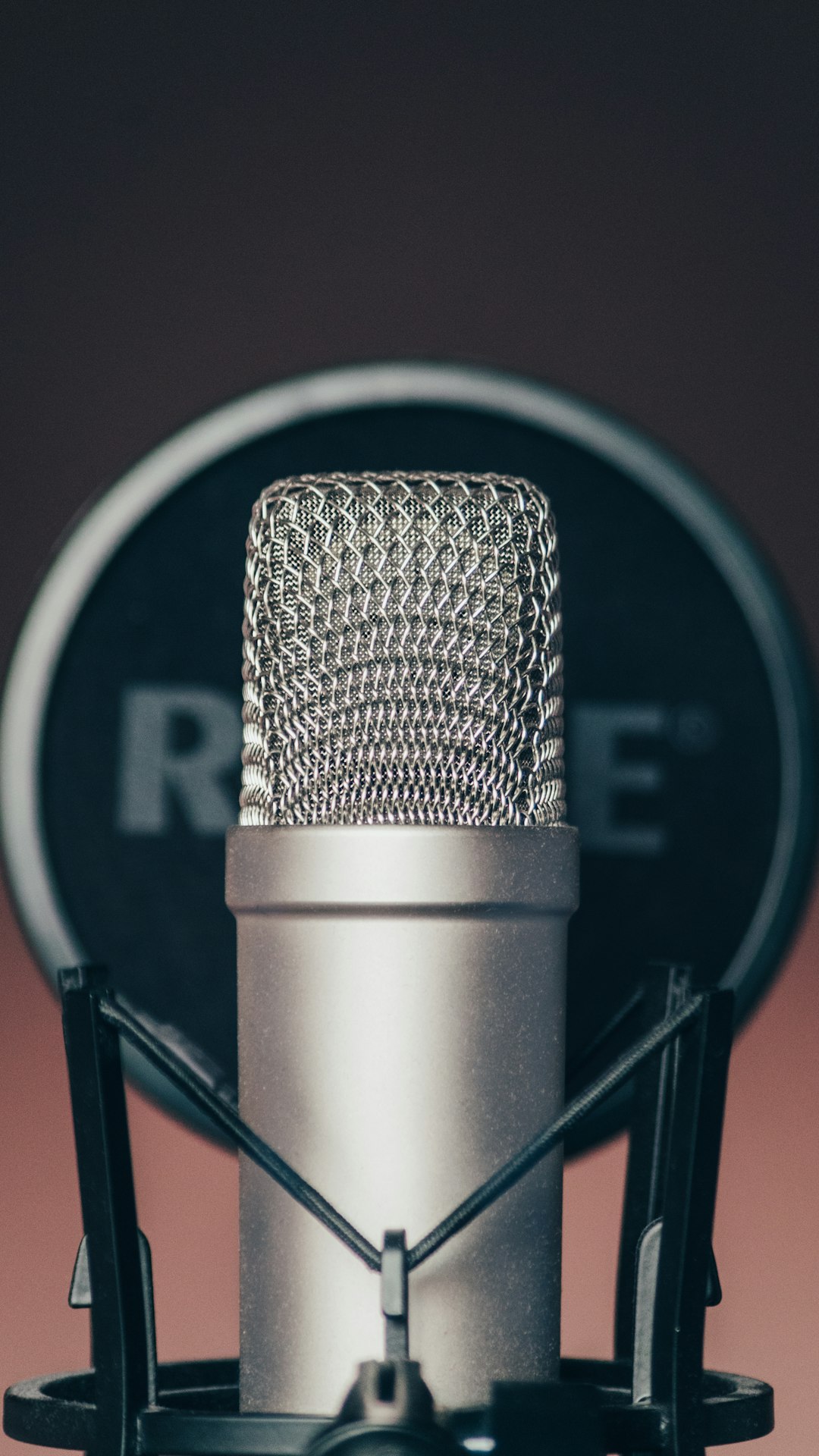 black and silver microphone on black and white microphone stand