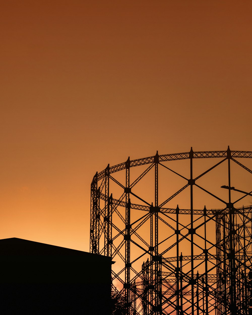 silhouette of metal tower during sunset