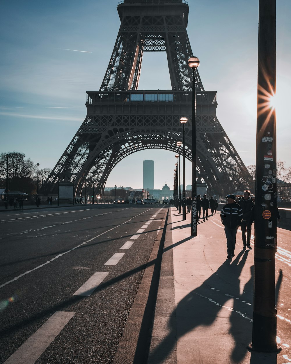 people walking on gray concrete bridge during daytime