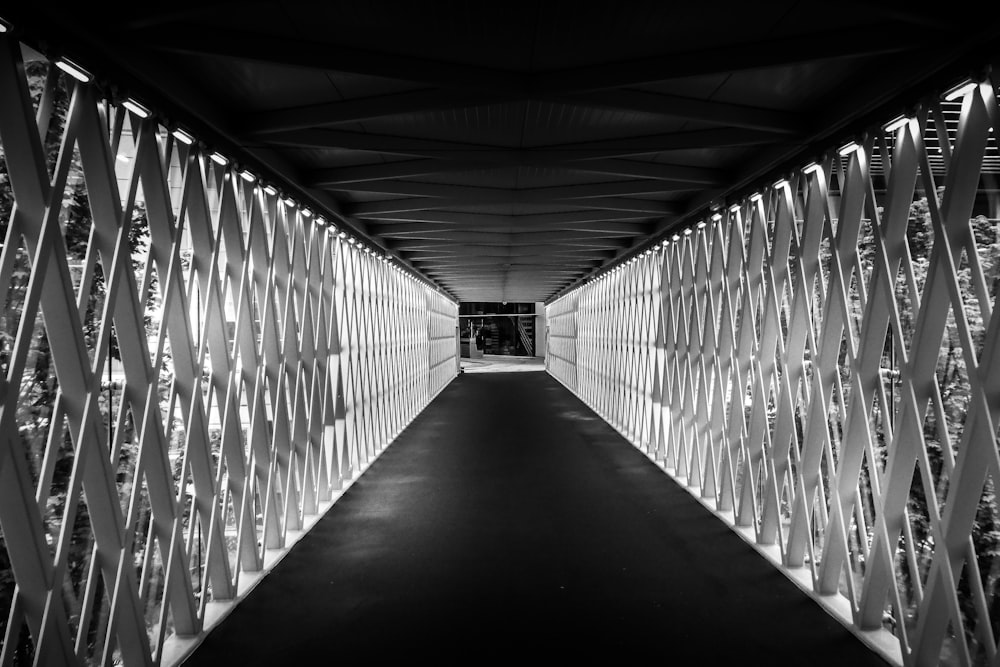 grayscale photo of hallway with no people