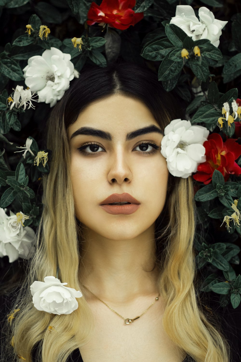 woman in white shirt with white flowers on her head