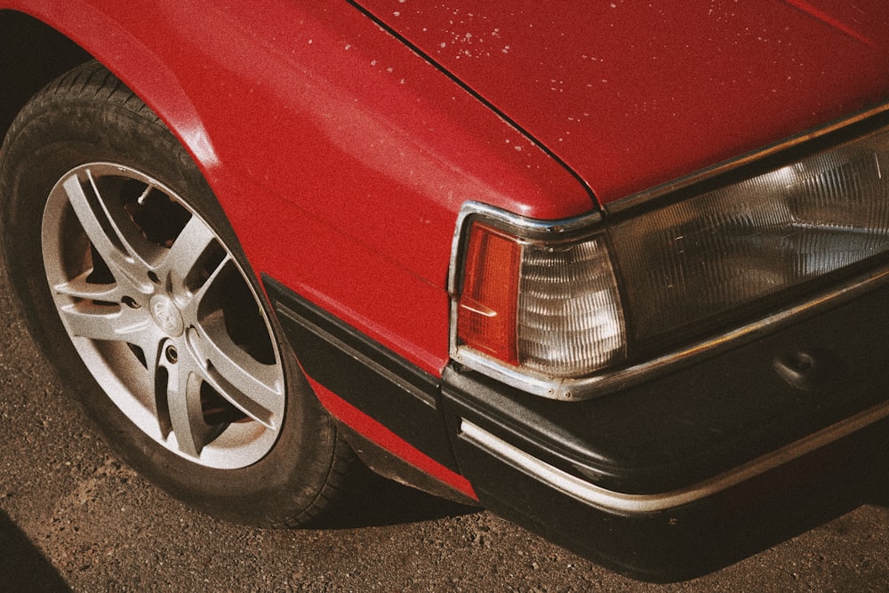 red car on gray asphalt road