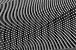A high-contrast black and white abstract pattern with sharp lines.