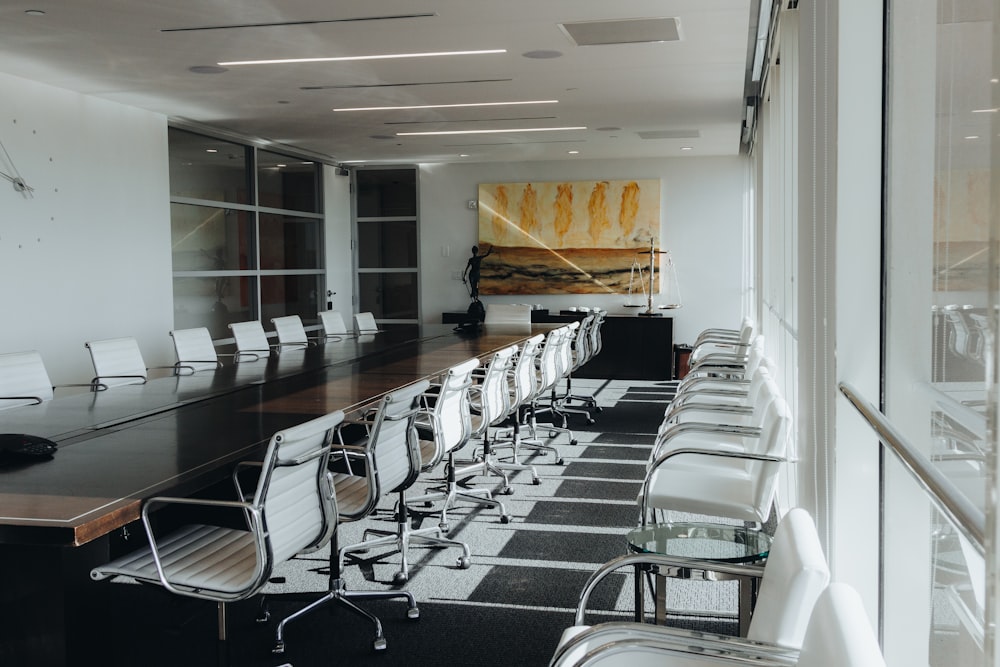 stainless steel framed white padded chairs