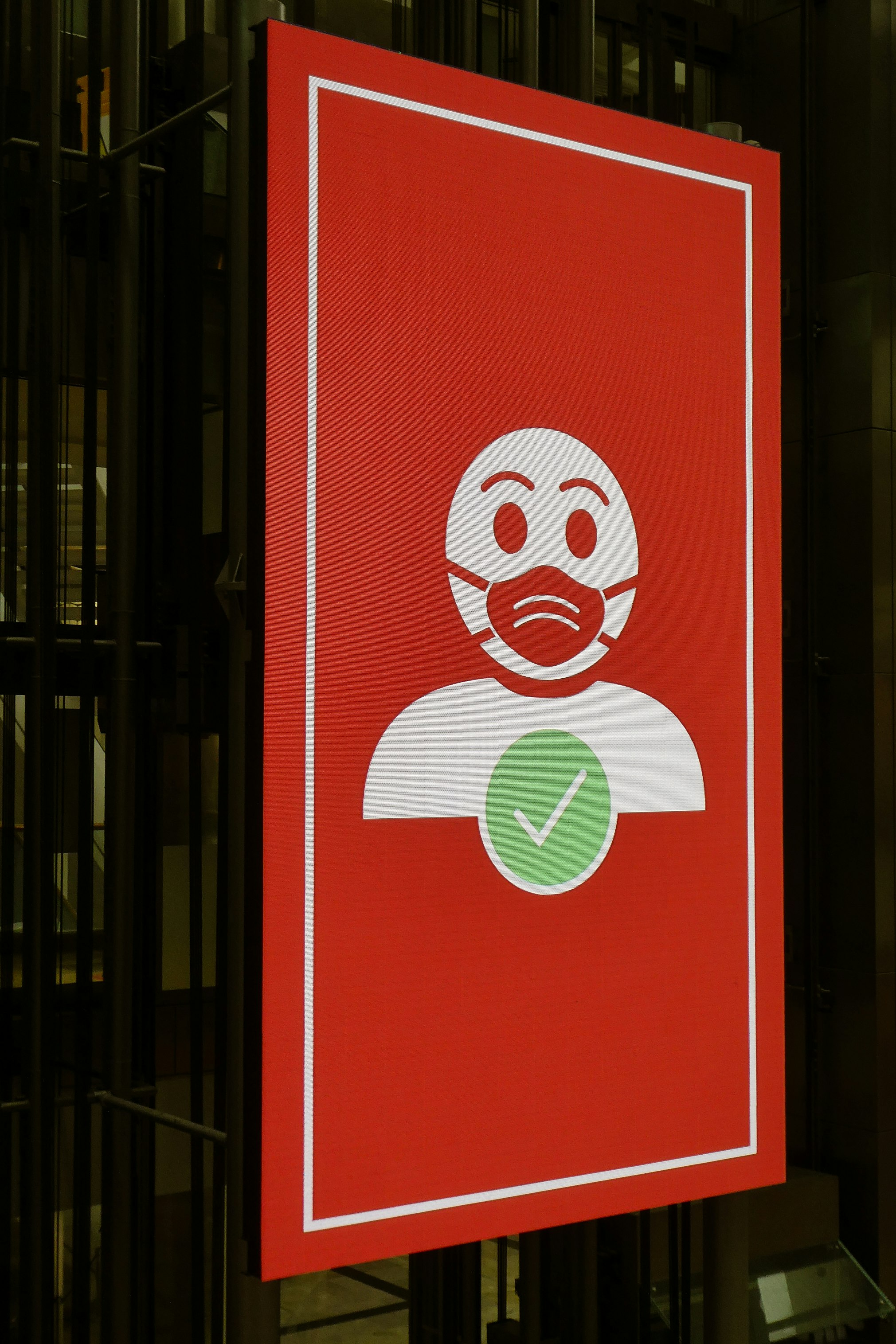 An instruction sign, showing the correct way to wear a mask.