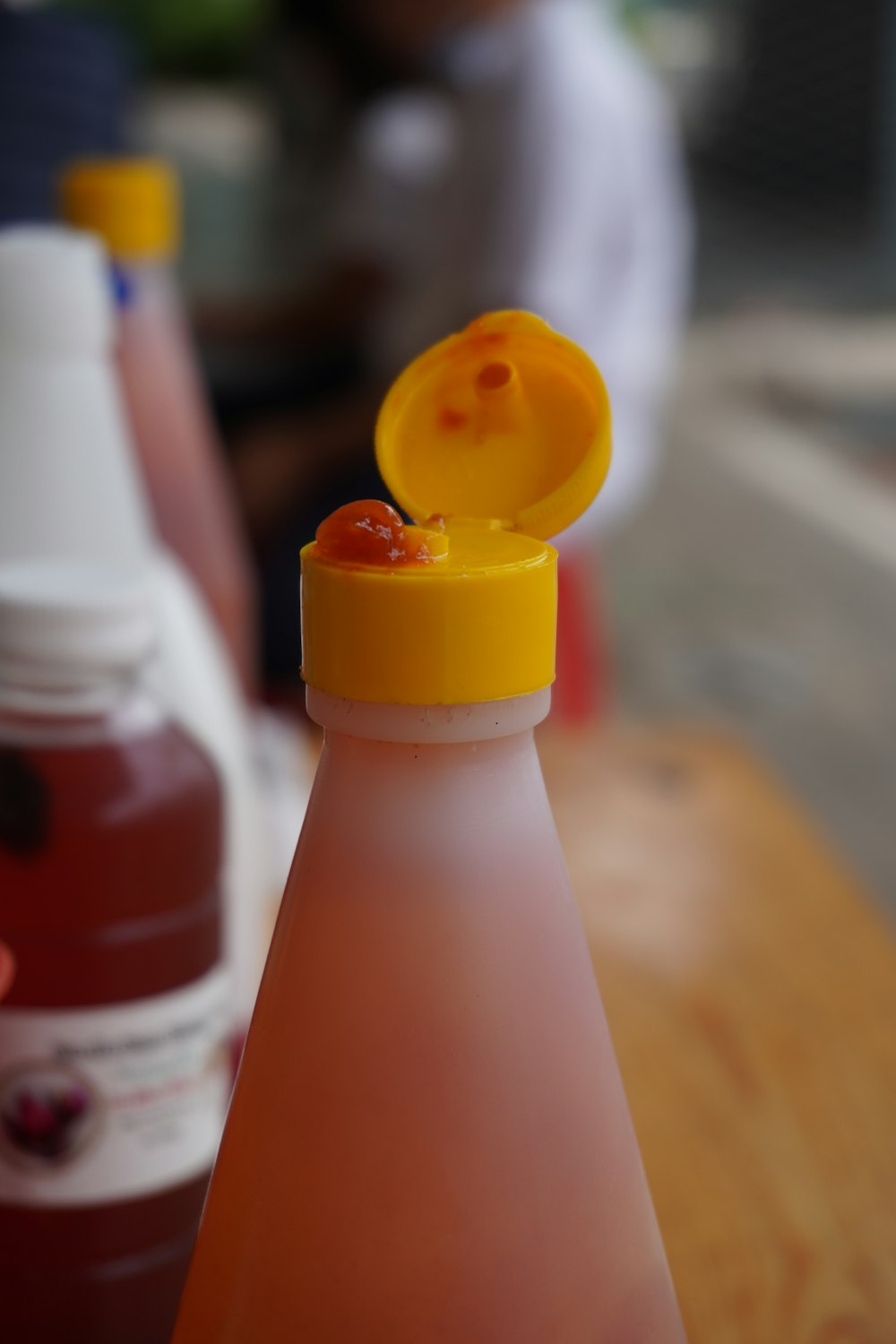 orange and white plastic bottle