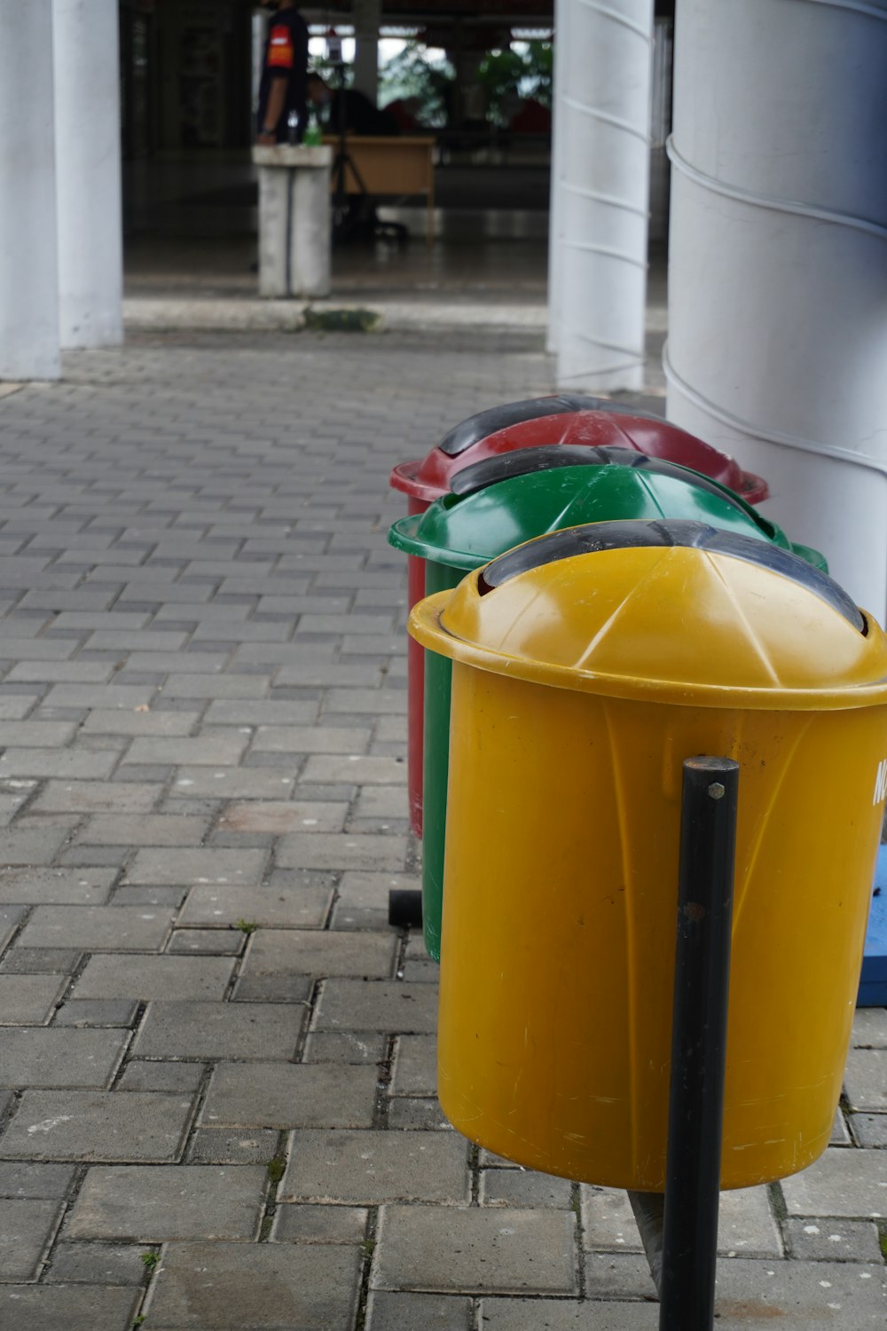 yellow and green trash bin