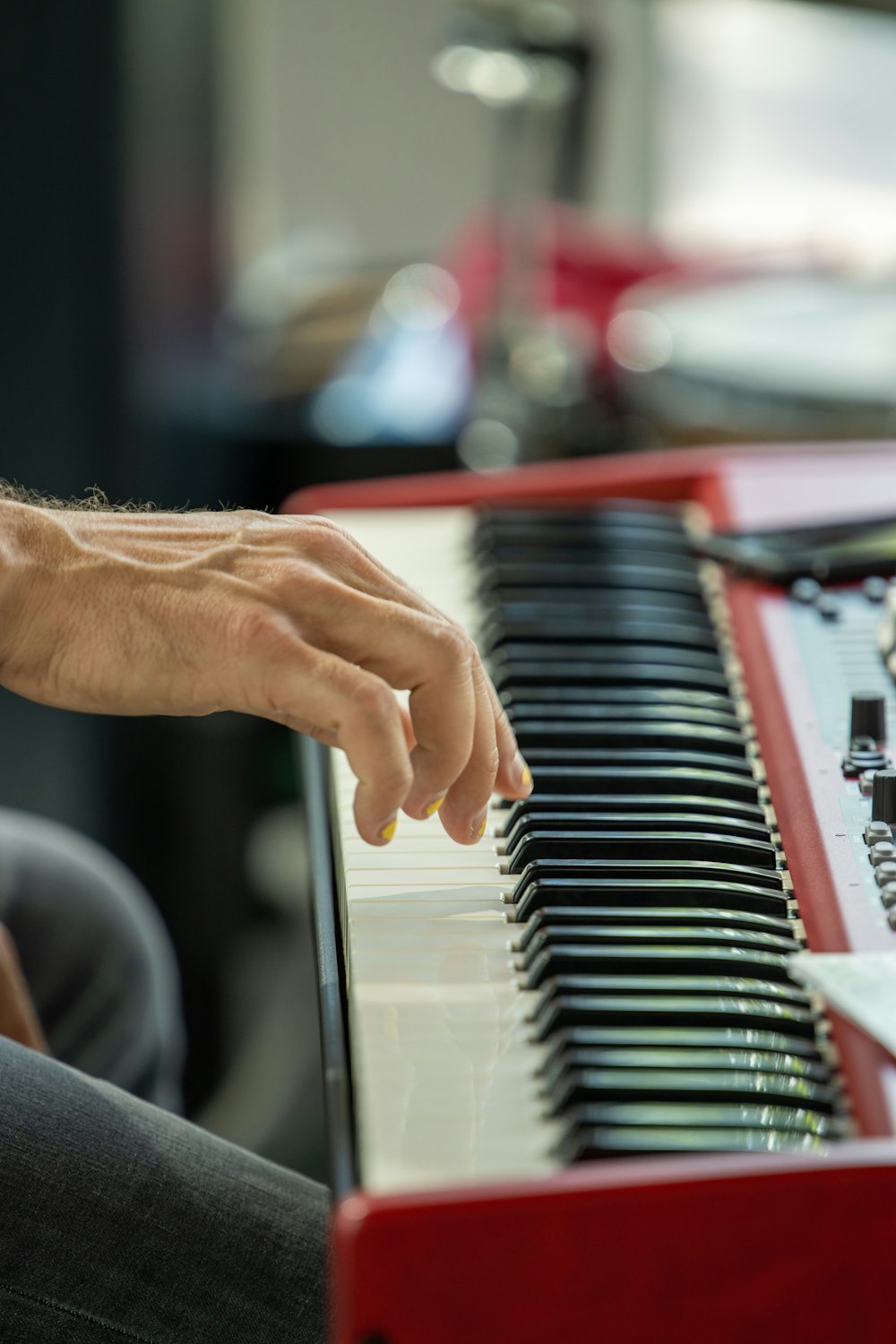 person playing piano in tilt shift lens