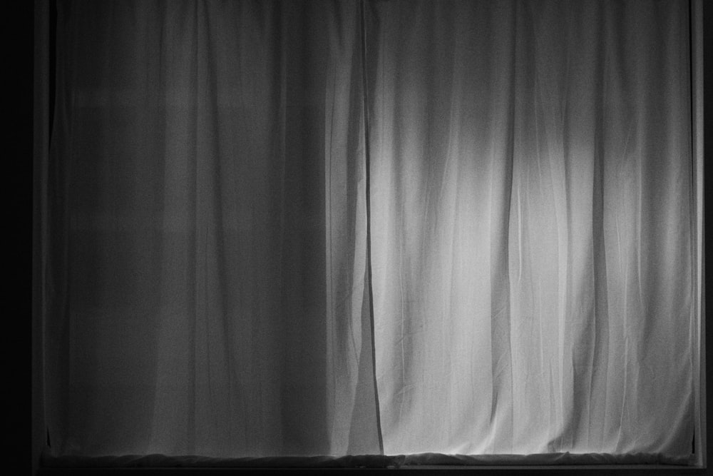 white window curtain in grayscale