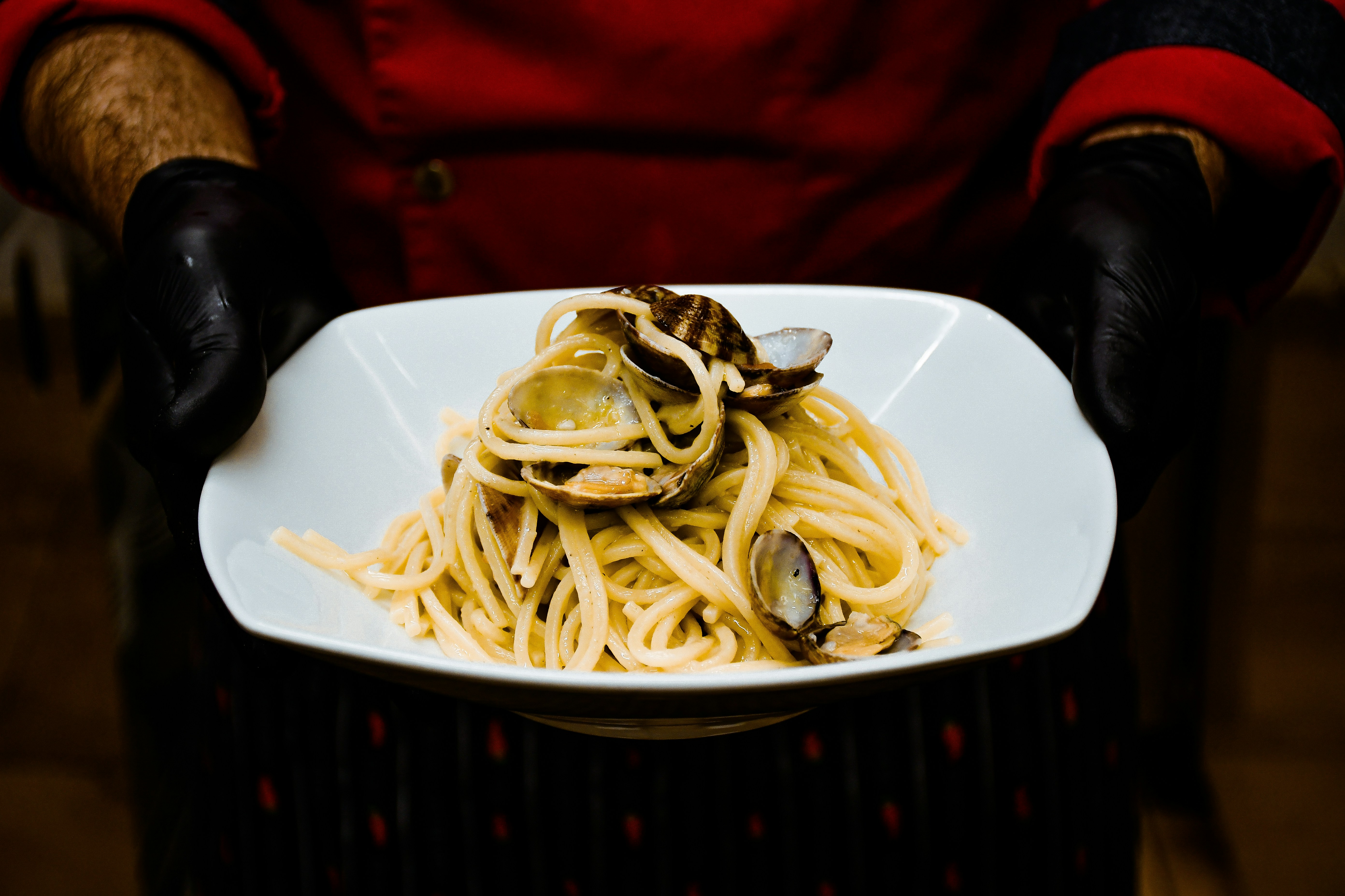 Spaghetti with clams in a dark setting