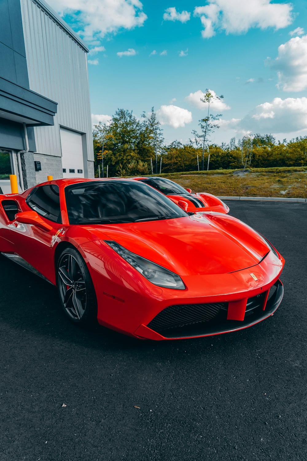 red ferrari 458 italia parked on road during daytime