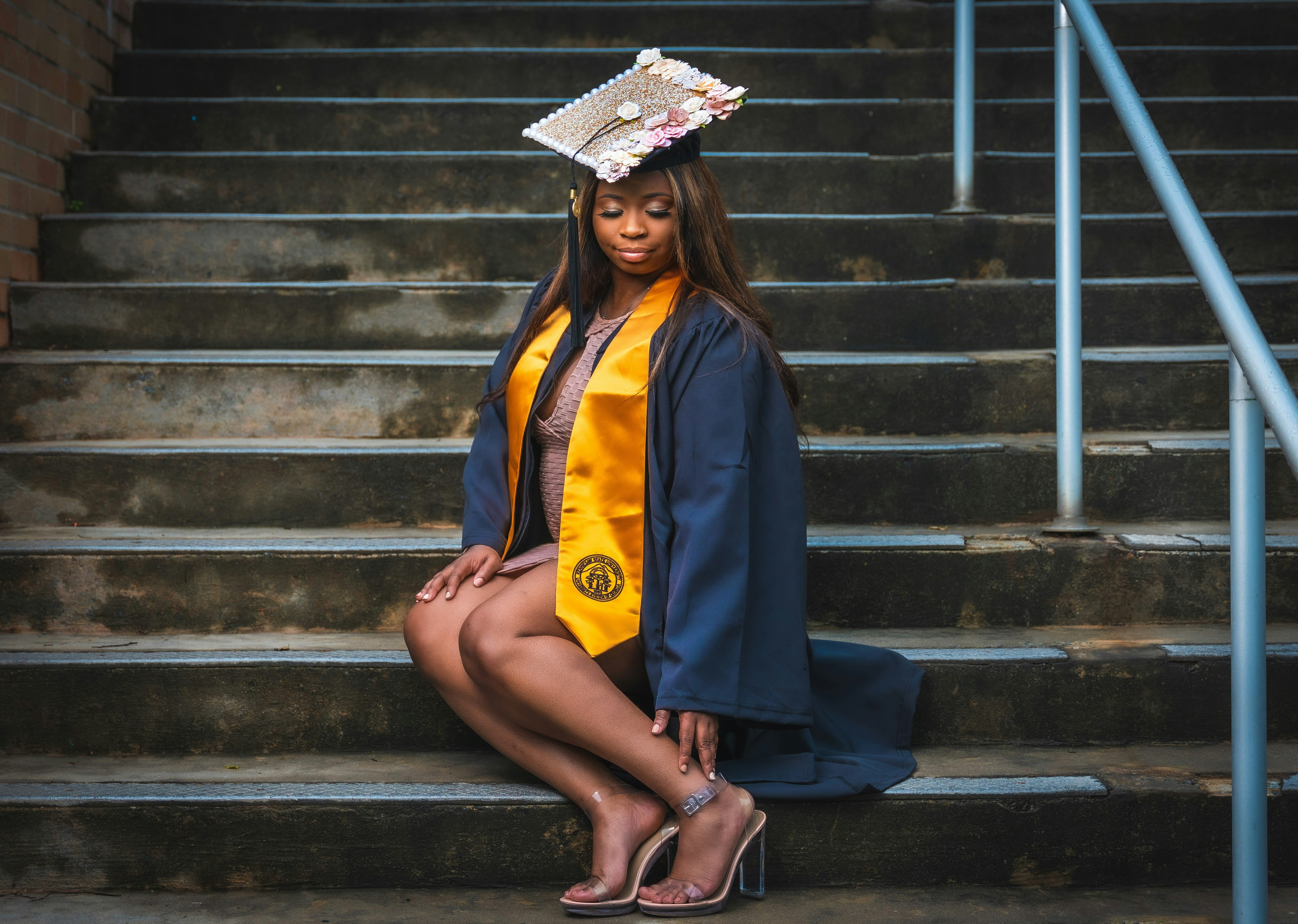 Graduation ceremony with students in caps and gowns.