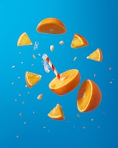 sliced orange fruit on blue surface