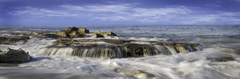 time lapse photography of water falls