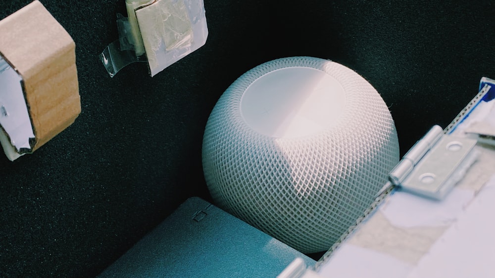 black round speaker on black table