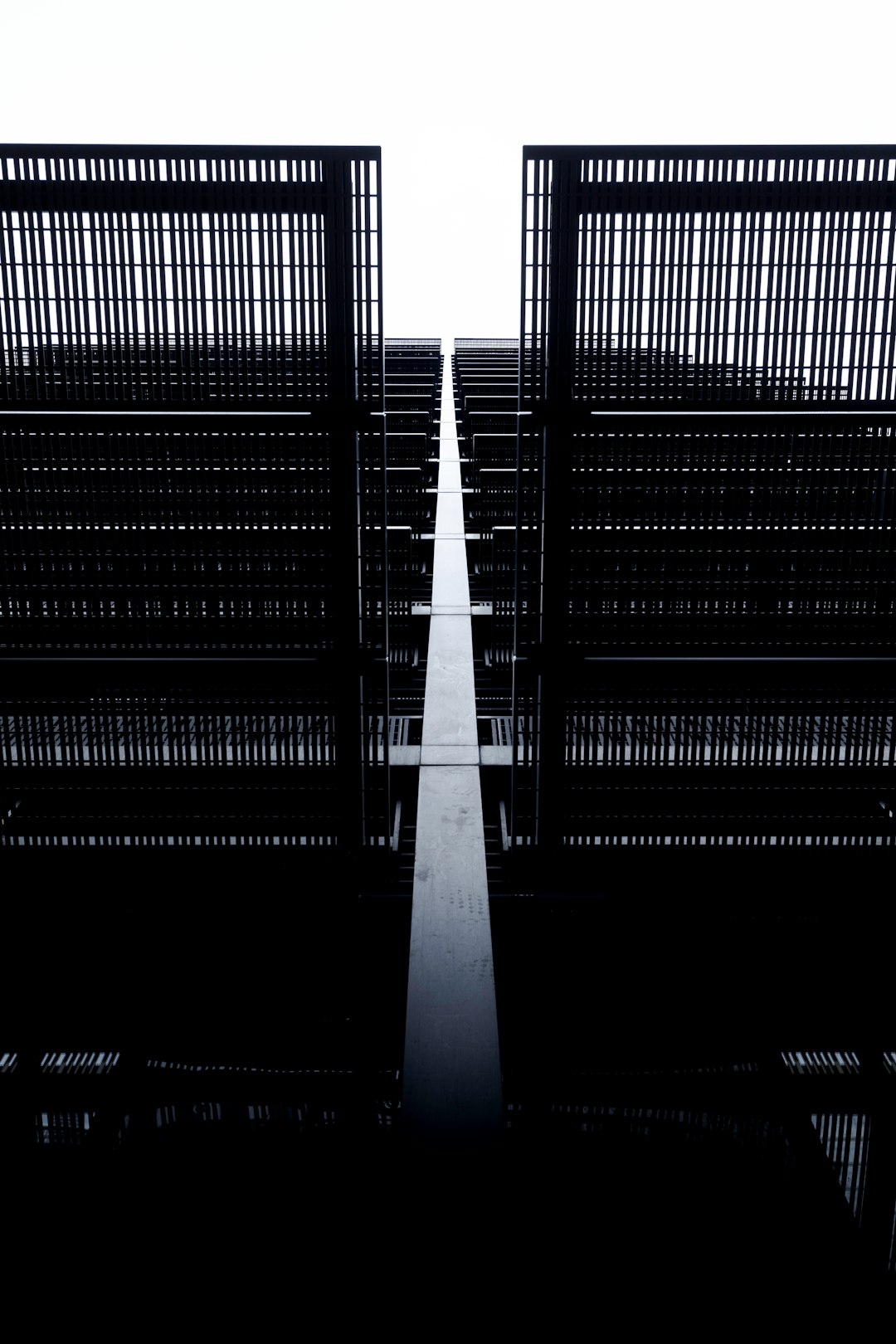 black and white tunnel with black metal railings