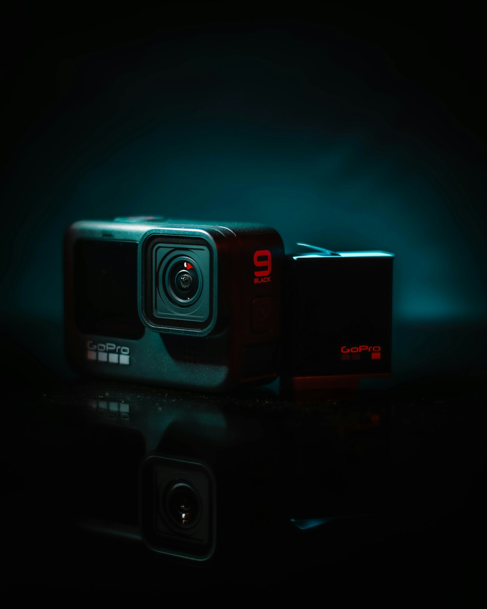 black and red camera on black surface