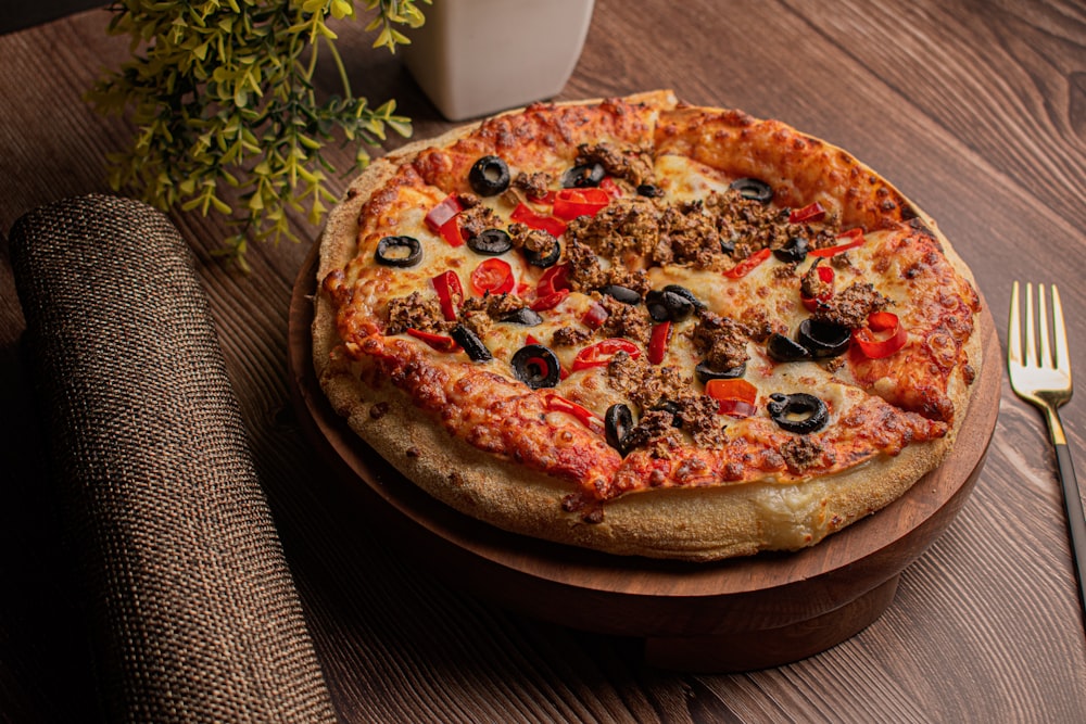 pizza on brown wooden tray