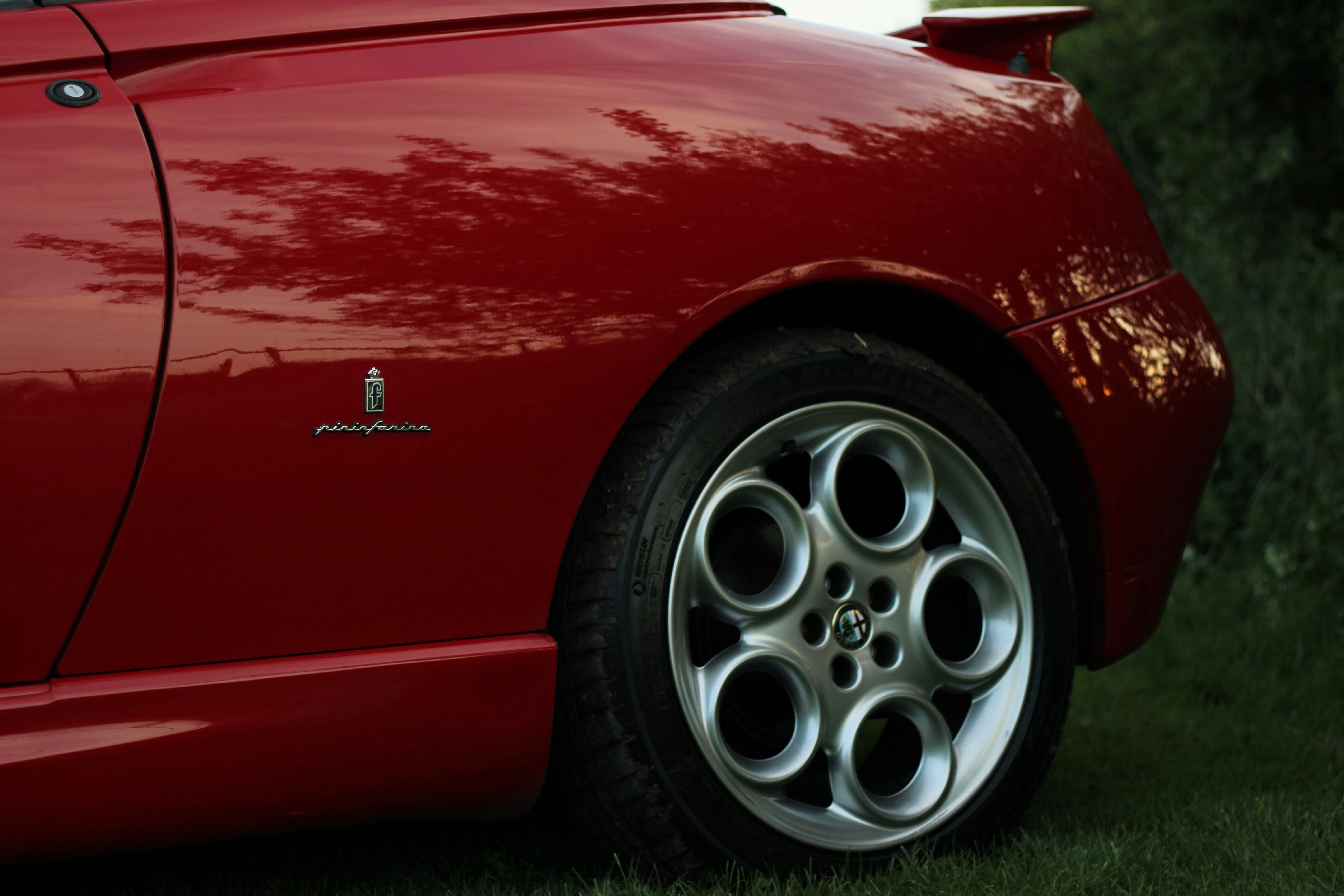 Red car with silver wheel photo – Free Car Image on Unsplash