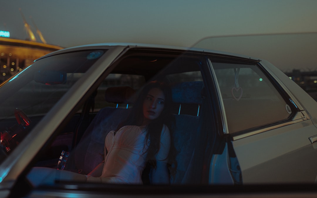 woman in black shirt sitting inside car