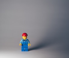 lego minifig on white surface