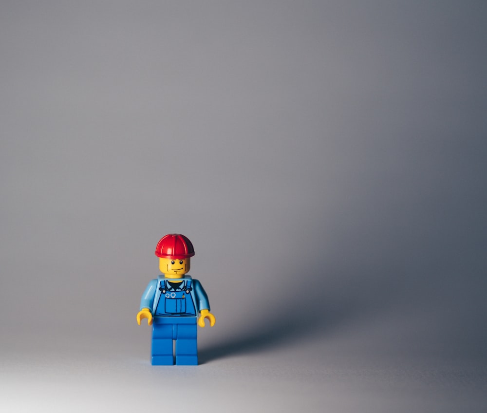 lego minifig on white surface