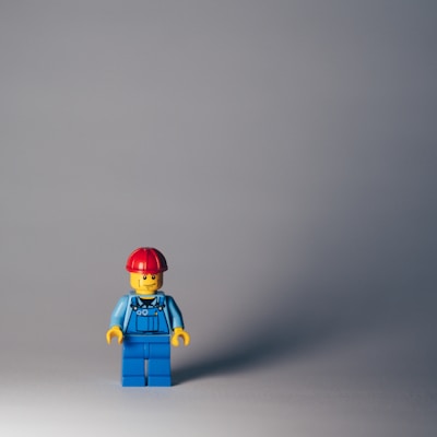 lego minifig on white surface