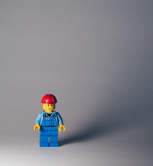 lego minifig on white surface