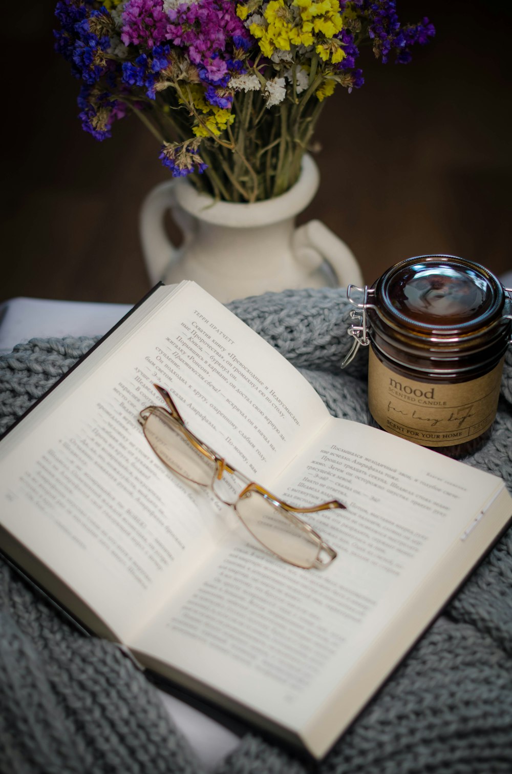 silver framed eyeglasses on book page