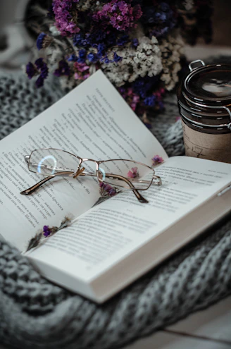gold framed eyeglasses on book page