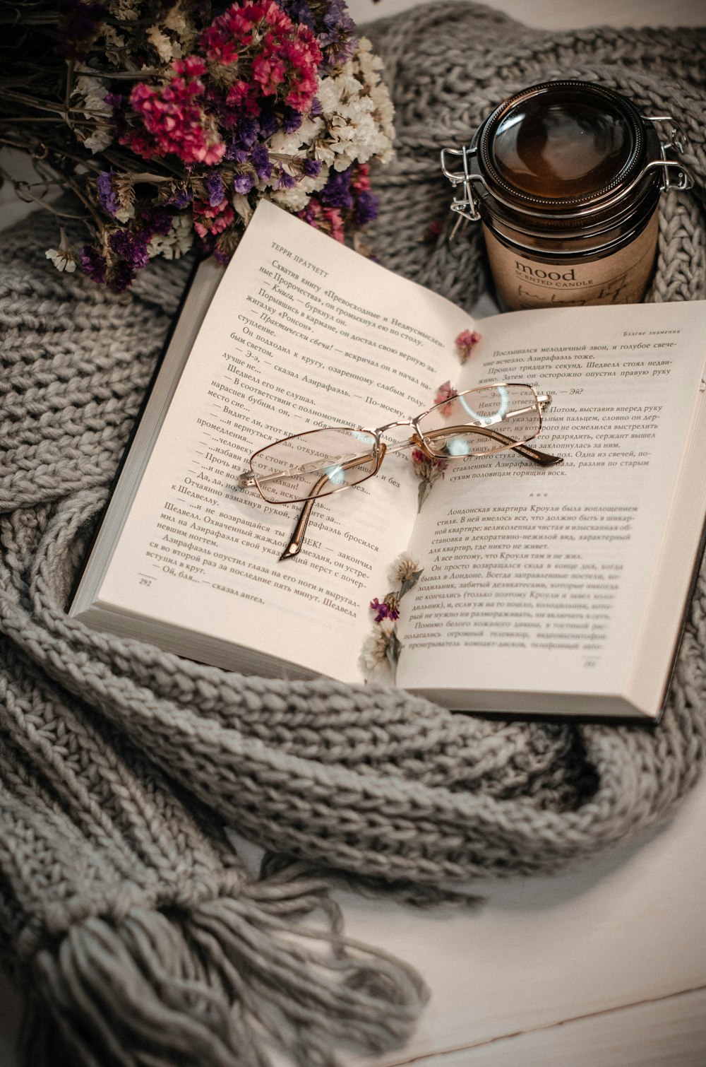 silver framed eyeglasses on book page