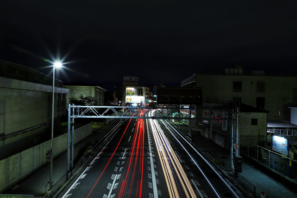 time lapse photography of cars on road during night time