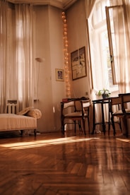 white bed linen near brown wooden chair