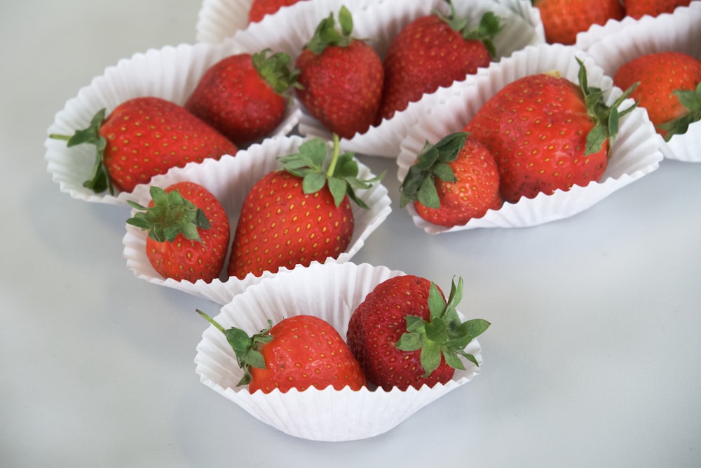 red strawberries on white ceramic plate