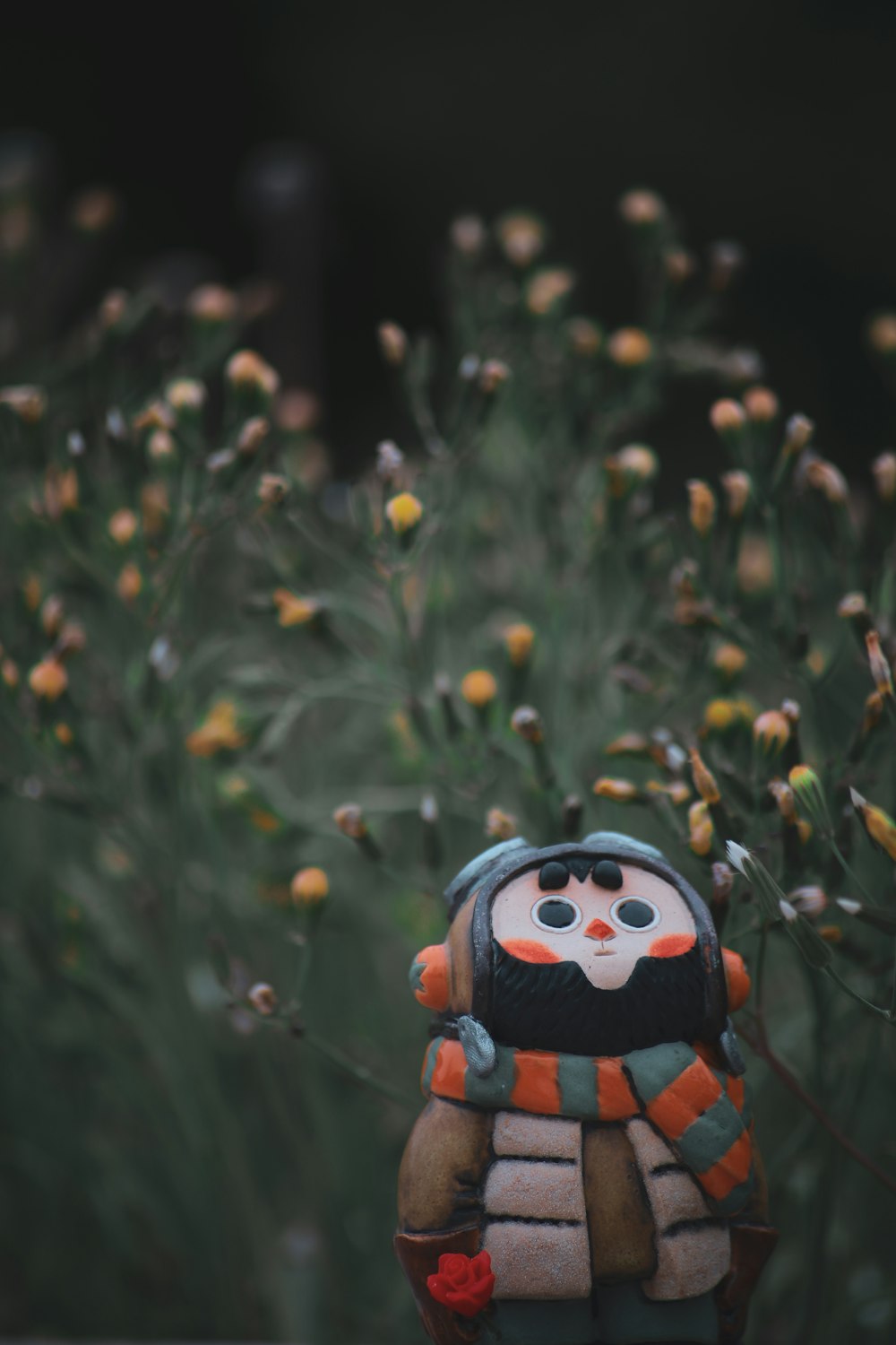 red and black lego toy on green grass