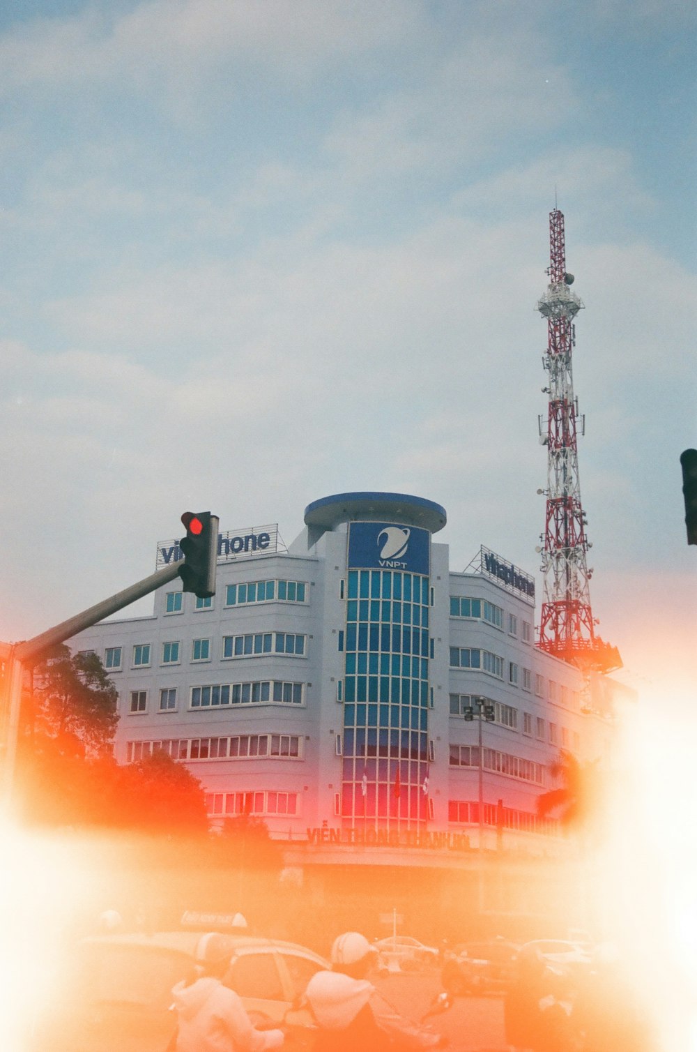 white and black concrete building with orange smoke