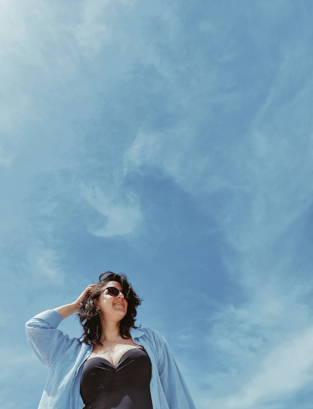 woman in white shirt under blue sky during daytime