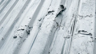 white snow on gray concrete wall